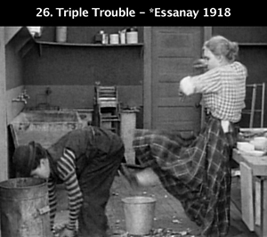 Edna Purviance and Charlie Chaplin in Police
