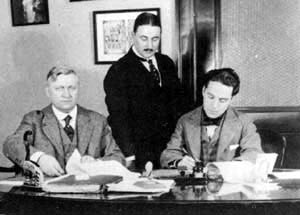 Sydney Chaplin and Charlie Chaplin at the Mutual signing